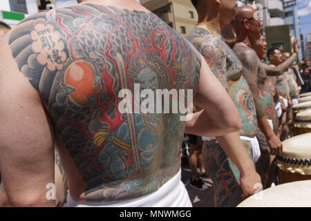 Tokyo, Japan. 20th May 2018. Participants showing their full body tattooed, possibly members of the Japanese mafia or Yakuza, attend the Sanja Matsuri in Asakusa district. The Sanja Matsuri is one of the largest Shinto festivals in Tokyo, and it is held in Tokyo's Asakusa district for three days around the third weekend of May. Credit: ZUMA Press, Inc./Alamy Live News Stock Photo