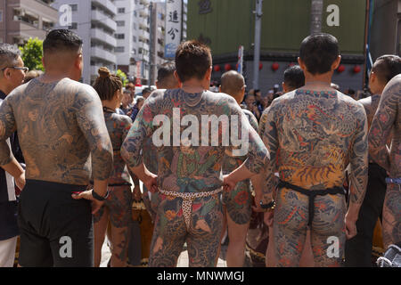 Tokyo, Japan. 20th May 2018. Participants showing their full body tattooed, possibly members of the Japanese mafia or Yakuza, attend the Sanja Matsuri in Asakusa district. The Sanja Matsuri is one of the largest Shinto festivals in Tokyo, and it is held in Tokyo's Asakusa district for three days around the third weekend of May. Credit: ZUMA Press, Inc./Alamy Live News Stock Photo