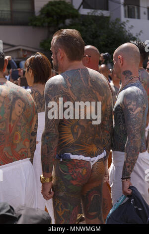 Tokyo, Japan. 20th May 2018. Participants showing their full body tattooed, possibly members of the Japanese mafia or Yakuza, attend the Sanja Matsuri in Asakusa district. The Sanja Matsuri is one of the largest Shinto festivals in Tokyo, and it is held in Tokyo's Asakusa district for three days around the third weekend of May. Credit: ZUMA Press, Inc./Alamy Live News Stock Photo