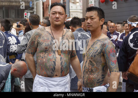 Tokyo, Japan. 20th May 2018. Participants showing their full body tattooed, possibly members of the Japanese mafia or Yakuza, attend the Sanja Matsuri in Asakusa district. The Sanja Matsuri is one of the largest Shinto festivals in Tokyo, and it is held in Tokyo's Asakusa district for three days around the third weekend of May. Credit: ZUMA Press, Inc./Alamy Live News Stock Photo