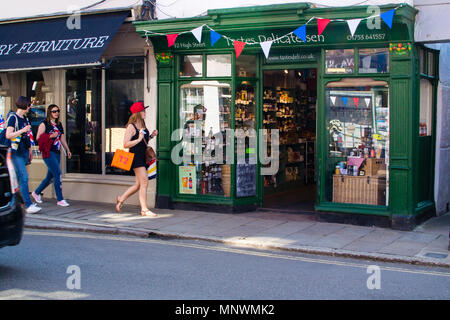 Eton, UK. 19th May 2018. Pedestrians return from Royal Wedding at Windsor Castle passing local shops on Eton High Street.  Credit: Karen Hunt/Alamy Live News Stock Photo