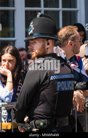 Policing the Royal Wedding of Prince Harry to Meghan Markle took many forms from the traditional Bobby on the beat and Mounted Officers to the Heavily Armed Firearms officers carrying Automatic weapons who were very much in evidence. This policeman even looked like the Groom, Prince Harry look alike Credit: David Betteridge/Alamy Live News Stock Photo