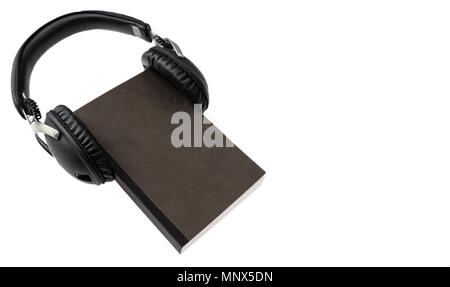 Audio book concept. Black book and wireless headphones set isolated on white background Stock Photo