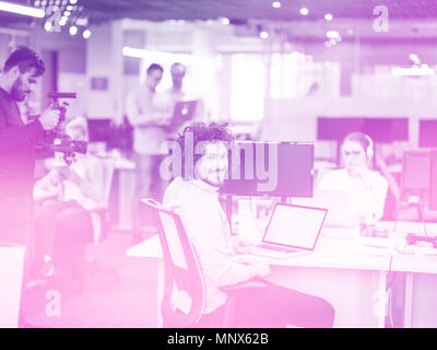 Young Entrepreneur Freelancer Working Using A Laptop In Coworking space Stock Photo