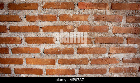 The backdrop of orange brick walls is not plastered. Stock Photo