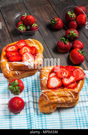 dessert fruit cakes with strawberry on wood background. Stock Photo