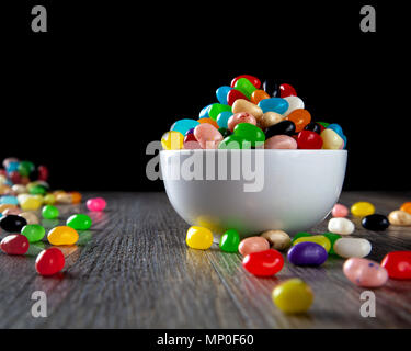 Jelly Beans in a white bowl on the table Stock Photo