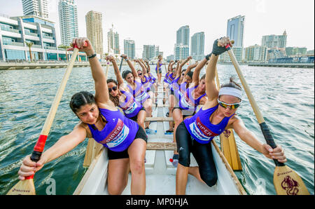 Woman rowing team Dubai Marina Stock Photo