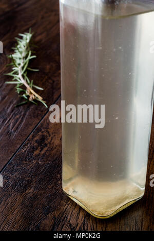 White Vinegar in bottle with rosemary. Organic Food. Stock Photo
