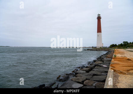 Barnegat Lighthouse or Barnegat Light, colloquially known as 'Old Barney', is a historic lighthouse located in Barnegat Lighthouse State Park, NJ Stock Photo