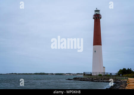 Barnegat Lighthouse or Barnegat Light, colloquially known as 'Old Barney', is a historic lighthouse located in Barnegat Lighthouse State Park, NJ Stock Photo