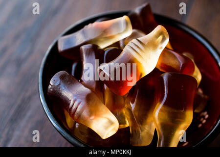 Cola flavored gummy jellies in the shape of bottles. Confectionery Concept. Stock Photo