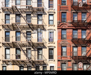 Tenement with fire escapes in Brooklyn as seen through the scratched ...