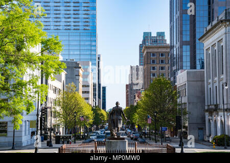 RALEIGH, NC - APRIL 17, 2018: George Washington Statue and Downtown Raleigh, North Carolina on Fayetteville Street from the Capitol Building Stock Photo