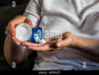 Woman with overweight takes medication, conceptual image Stock Photo