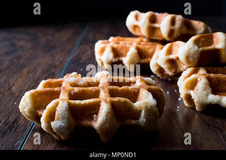 Plain Belgium Waffle on wooden surface. Traditional Food. Stock Photo