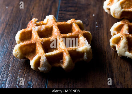 Plain Belgium Waffle on wooden surface. Traditional Food. Stock Photo