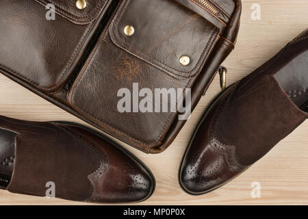 luxurious leather brown shoes with leather briefcase. Men's accessories. Fashion. Stock Photo