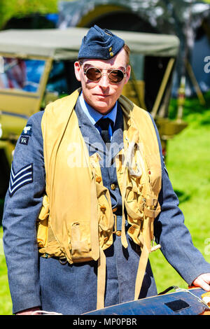 Popular Salute to the 40s event at Sandwich town, Kent. World war two young man re-enactor, RAF pilot with life jacket on. Close up. Facing. Stock Photo