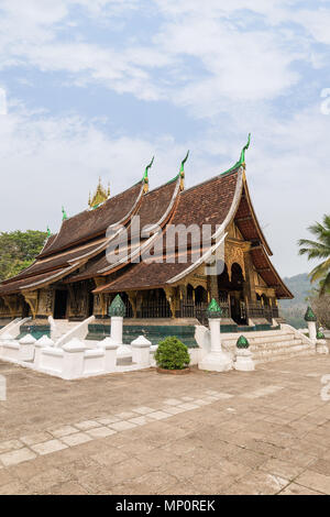 View of the Buddhist Wat Xieng Thong temple ('Temple of the Golden City') in Luang Prabang, Laos. Stock Photo