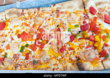 Slice of hot pizza large cheese lunch or dinner crust seafood meat topping sauce. with bell pepper vegetables delicious tasty fast food italian tradit Stock Photo