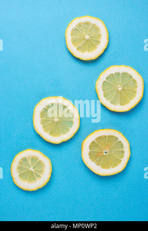 Sliced lemon on blue background Stock Photo