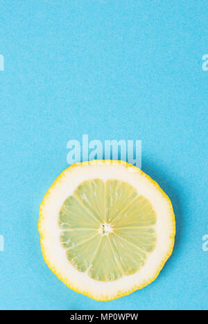 Sliced lemon on blue background Stock Photo