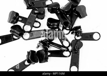 Zipper fasteners from above in black and white Stock Photo