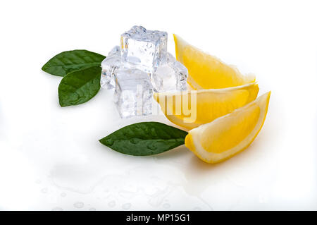 three slices of fresh lemon and green leaves, cubes of cold ice, on white background. in isolation. Stock Photo