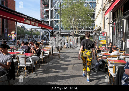 Paris street scene outside Dame Tartine on Rue Brisemiche with a view of the Pompidou Centre building in spring Paris France Europe  KATHY DEWITT Stock Photo