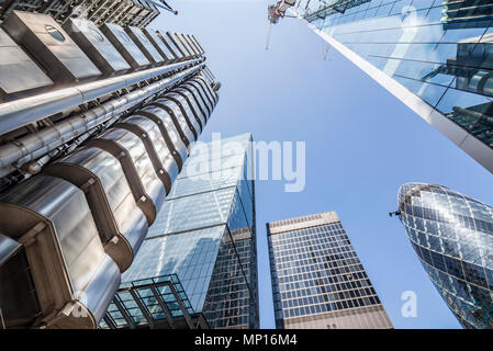 Looking up at the Lloyds Building (left), the Leadenhall Building, 122 Leadenhall Street, the Gherkin and the Scalpel in London. Stock Photo