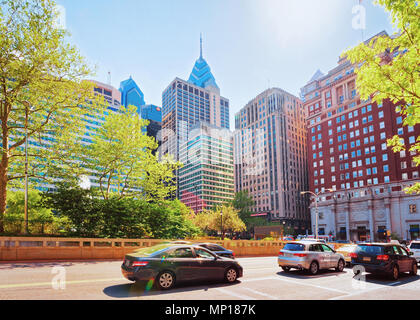 Road at Love Park and Penn Center with skyline of skyscrapers in Philadelphia, Pennsylvania, USA. It is central business district in Philadelphia. Tou Stock Photo