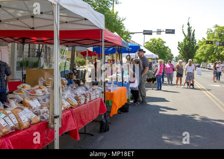 Yakima, Washington / USA - May 21, 2018: People from around the community of Yakima gather on a beautiful day at the downtown farmer's market. Stock Photo