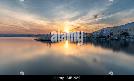 Long exposure of a harbour at sunset on the Costa del Sol in Spain Stock Photo