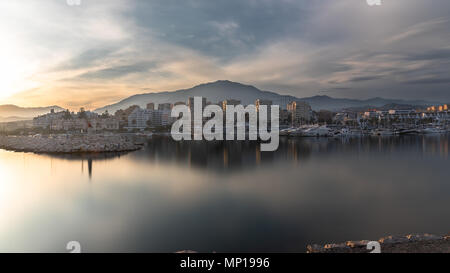 Long exposure of a harbour at sunset on the Costa del Sol in Spain Stock Photo