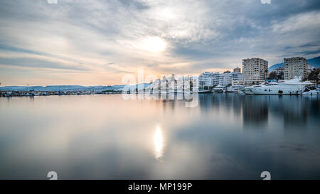 Long exposure of a harbour at sunset on the Costa del Sol in Spain Stock Photo