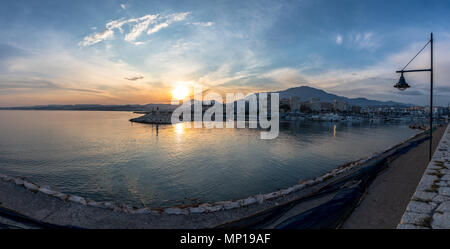 Long exposure of a harbour at sunset on the Costa del Sol in Spain Stock Photo