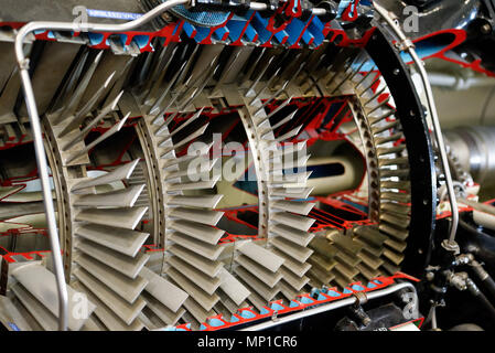 A cutaway model of a jet engine showing the turbine blades