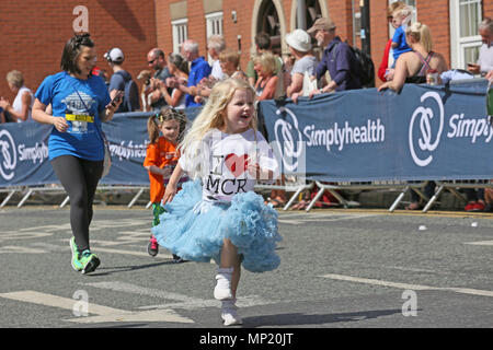 Manchester, UK. 20th May 2018. A young girl wearing a love Manchester shirt taking part in the mini run, Manchester,20th May, 2018 (C)Barbara Cook/Alamy Live News Stock Photo