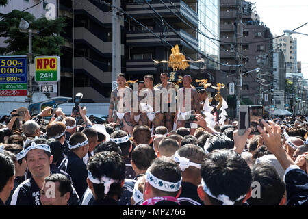 TOKYO, JAPAN - MAY 20: A heavily tattooed Japanese men stand on the mikoshi before carrying the portable shrine in the streets of Asakusa during Tokyo's one of the largest three day festival called 'Sanja Matsuri' on the third and final day, May 20, 2018 in Tokyo, Japan. A boisterous traditional mikoshi (portable shrine) is carried in the streets of Asakusa to bring luck, blessings and prosperity to the area and its inhabitants. (Photo: Richard Atrero de Guzman/ Aflo) Stock Photo