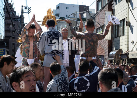 TOKYO, JAPAN - MAY 20: A heavily tattooed Japanese men stand on the mikoshi before carrying the portable shrine in the streets of Asakusa during Tokyo's one of the largest three day festival called 'Sanja Matsuri' on the third and final day, May 20, 2018 in Tokyo, Japan. A boisterous traditional mikoshi (portable shrine) is carried in the streets of Asakusa to bring luck, blessings and prosperity to the area and its inhabitants. (Photo: Richard Atrero de Guzman/ Aflo) Stock Photo