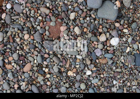 Pebbles on a Beach, Background Image of Pebbles Stock Photo