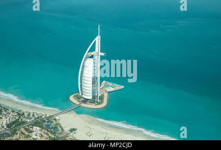 Dubai, UAE - May 18, 2018: Aerial view of Burj Al Arab luxury hotel on the coast of Persian Gulf on a clear sunny day. Stock Photo