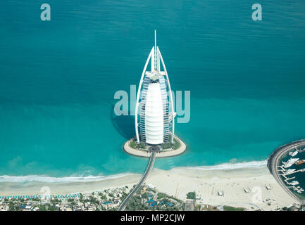 Dubai, UAE - May 18, 2018: Aerial view of Burj Al Arab luxury hotel on the coast of Persian Gulf on a clear sunny day. Stock Photo