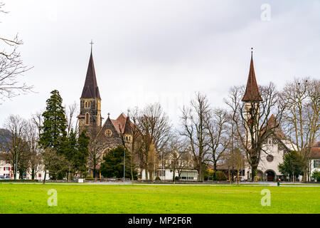 View of Catholic and Protestant churches in the well-known tourist destination town of Interlaken, Switzerland Stock Photo