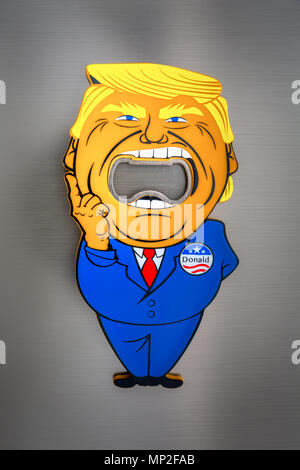 NEW YORK - MAY18, 2018: Donald Trump with mouth wide open bottle cap opener sold as a souvenir in a gift shop. Stock Photo