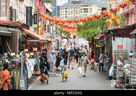 Singapore - April 23 2018: Tourists strolling around the various souvenir market stalls in Singapore Chinatown in Southeast Asia. Stock Photo