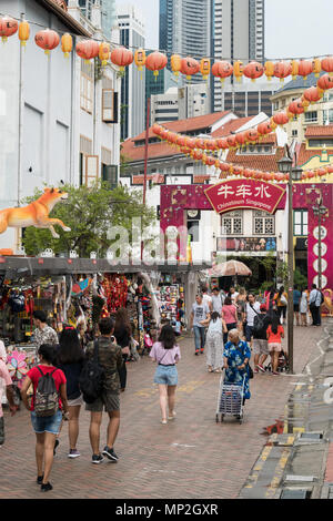 Singapore - April 23 2018: Tourists strolling around the various souvenir market stalls in Singapore Chinatown in Southeast Asia. Stock Photo