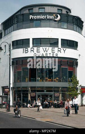 Exterior of the Brewery Quarter retail and leisure development and shoppers on the lower high street, Cheltenham, Gloucestershire. Stock Photo