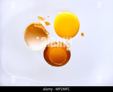 egg with shell shot from below on white Stock Photo
